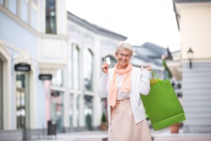 Senior woman with bags in shopping outlets