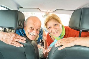 Happy retired senior couple ready for driving car on weekend